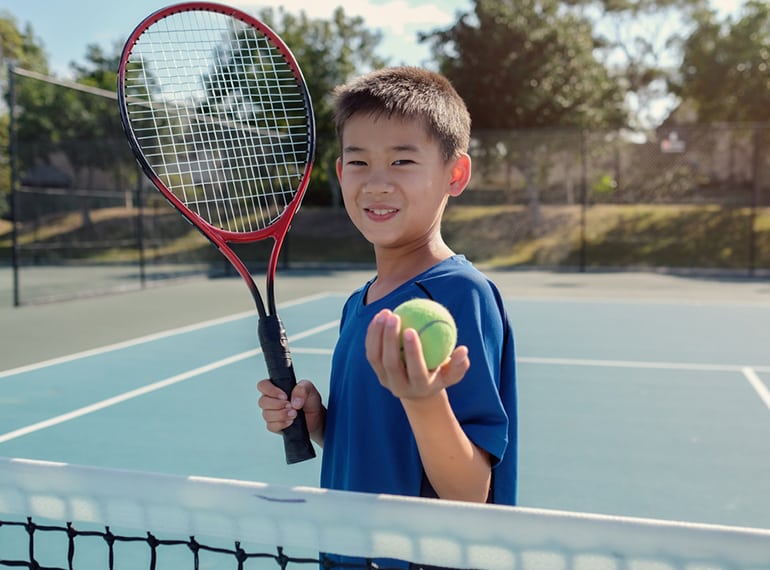 https://champslms.com/wp-content/uploads/2020/03/Asian-boy-playing-tennis.jpg